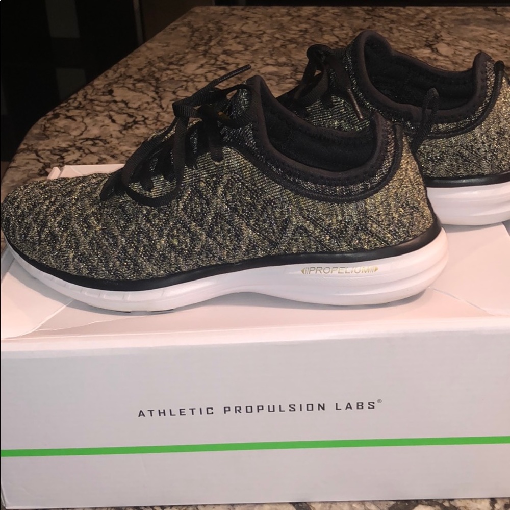 APL metallic thread sneakers.